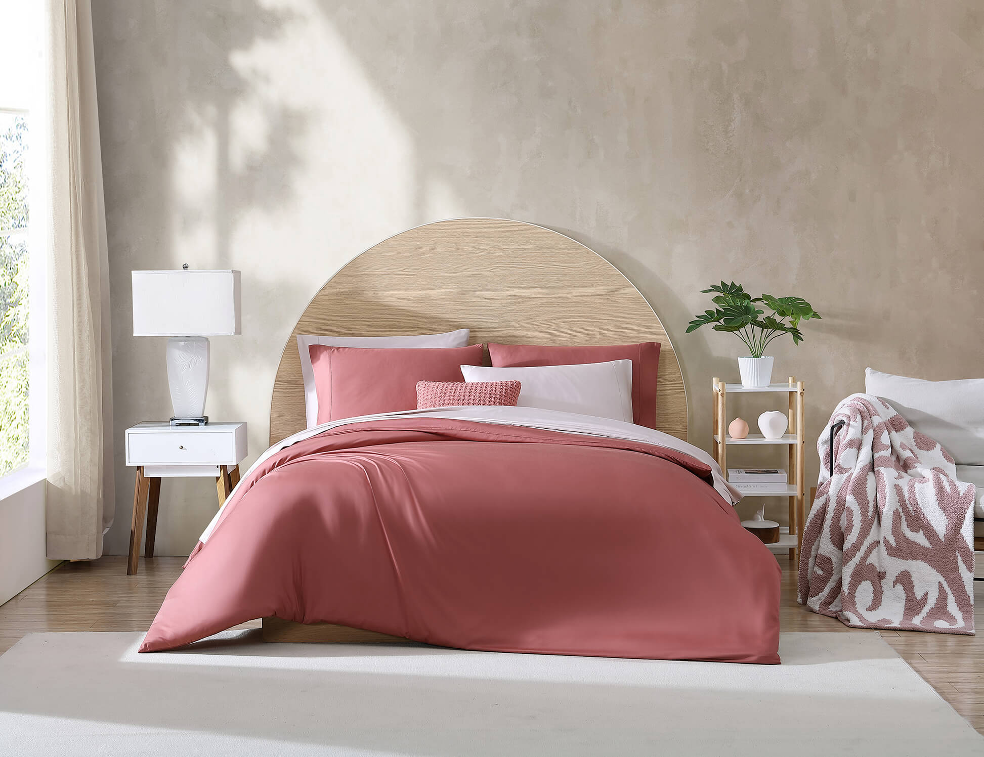 Bed Sytles: European Style Bed Making vs. Scandinavian Style Bed Making on this image we have a pink duvet on a bed with pink and white pillows.