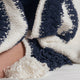 Sunday Citizen Braided Snug two tones Lite Throw in White - Midnight close-up of soft fabric texture 