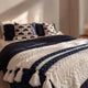 Sunday Citizen  Palm Leaf Pillow Navy - Off White styled on a modern bed