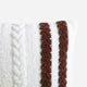 Sunday Citizen Braided Snug two tones Lite Throw Pillow in White - Fig close-up of soft fabric texture