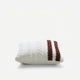 Sunday Citizen Braided Snug two tones Lite Throw Pillow in White - Fig close-up of soft fabric texture