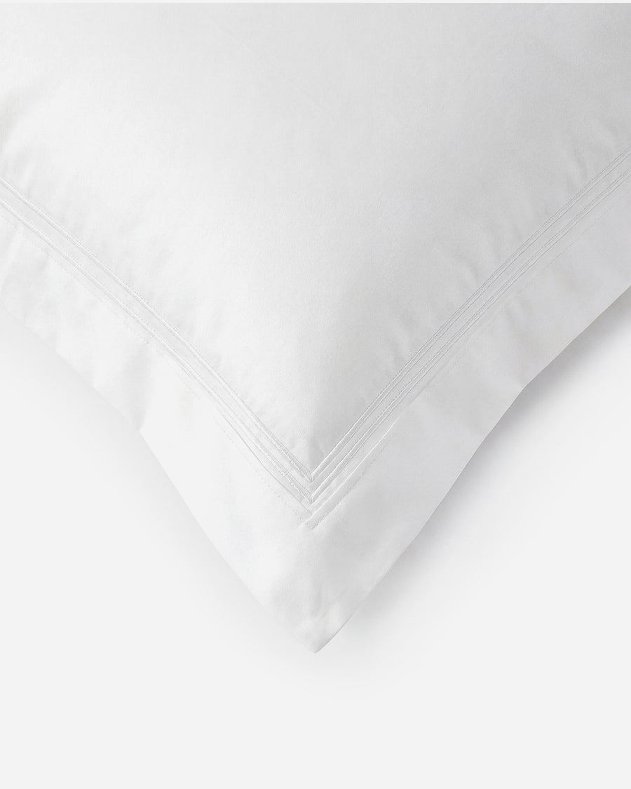 Sunday Citizen Luce Cotton Sateen Sham Set in White, close-up of soft fabric texture