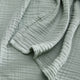 Sunday Citizen Muslin Throw in Jade  close-up of soft fabric texture
