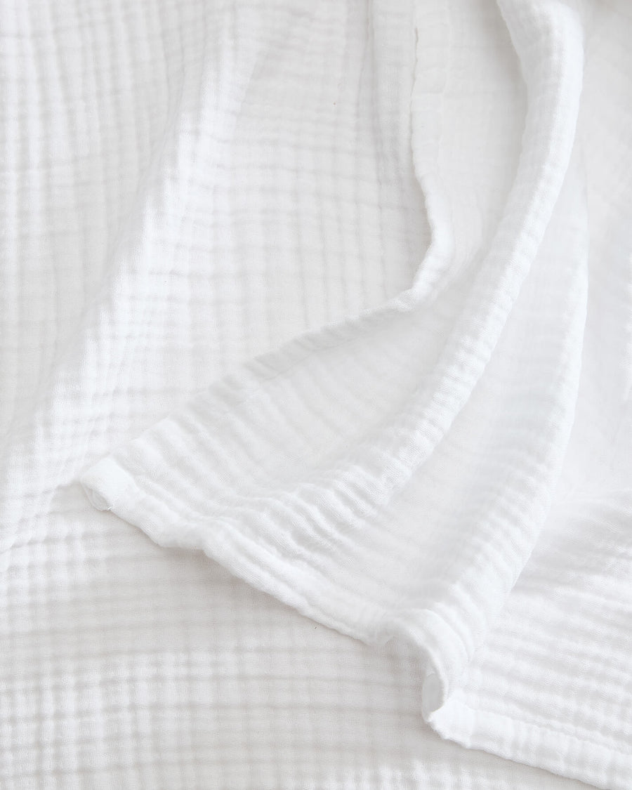 Sunday Citizen Muslin Throw in White close-up of soft fabric texture