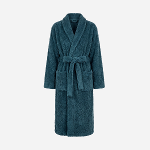 A plush, long-sleeved bathrobe in a deep teal blue-green color, featuring a shawl collar, matching tie belt, and front patch pockets, shown against a plain light gray background.