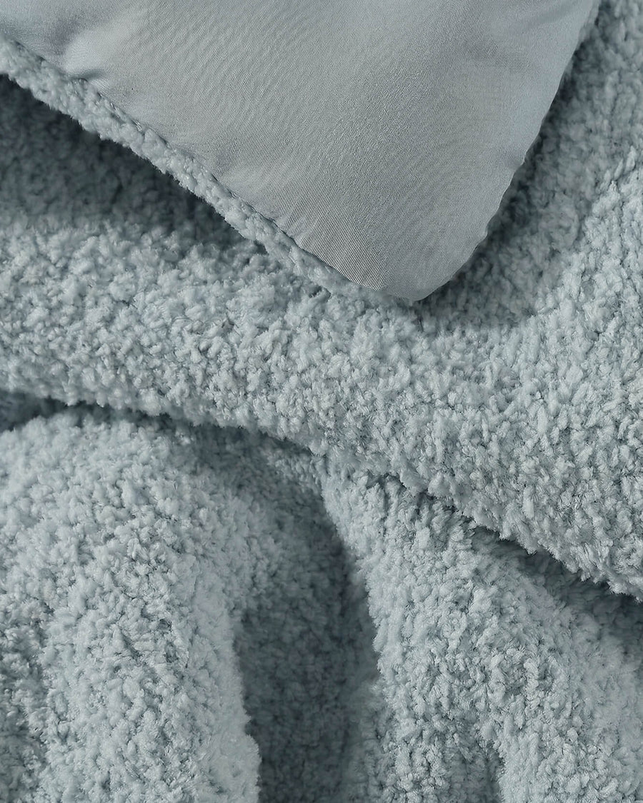 Sunday Citizen Snug Comforter in Misty Blue close-up of soft fabric texture