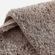 Sunday Citizen Spa Cotton Rug in Taupe close-up of soft fabric texture