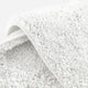 Sunday Citizen Spa Cotton Rug in Clear White close-up of soft fabric texture 
